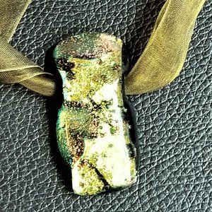 multi-colored green glass necklace on chiffon rope